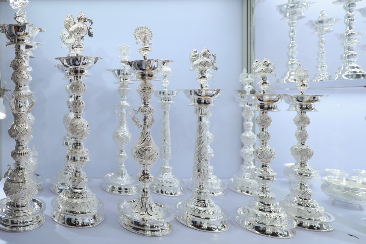 traditional Indian silver jewelry necklace with intricate designs, close-up product photography, luxury
