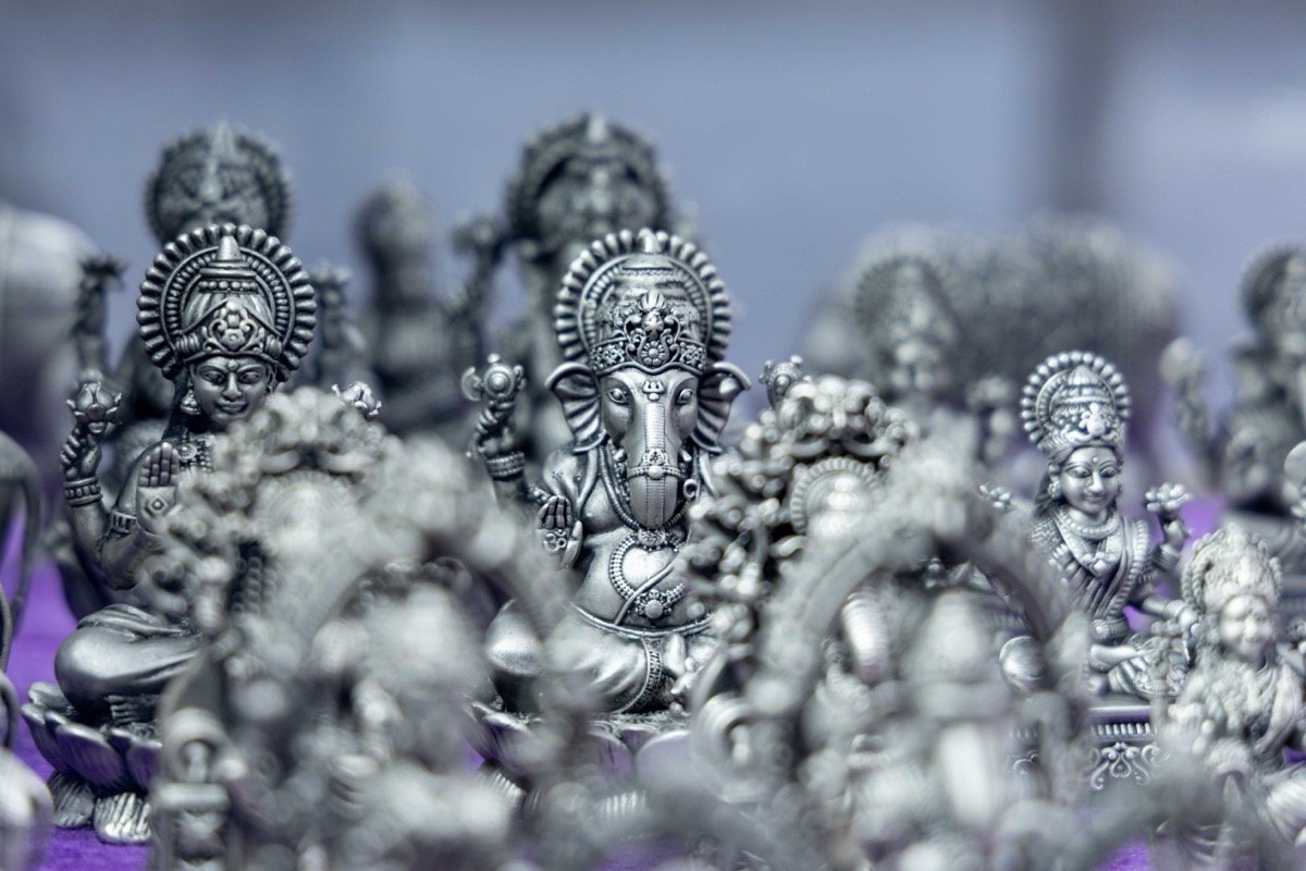silver pooja items and religious artifacts, traditional Indian silver utensils, luxury showcase